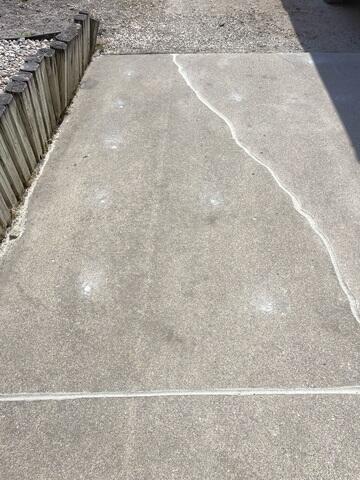 During: Our Foreman, Charlie, and his crew worked hard to secure the products below the sinking slabs.