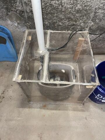 This homemade sump pump system kept some water out of the homeowner's basement, but when the rain started coming down hard, the basement would flood.