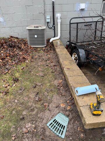 LawnScape outlet placed at discharge termination point, blending into the yard while ensuring safe water release.