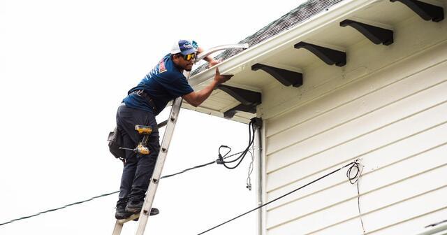Gutter Shutter installation underway to improve roof runoff management.