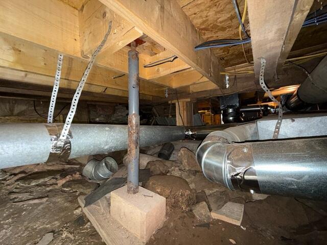 An unhealthy environment, with weakened support areas beneath the flooring system, caused sections of the floor above to feel unstable and sag over time.
