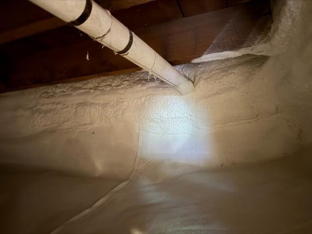 Closed-cell spray foam insulation along the rim joists