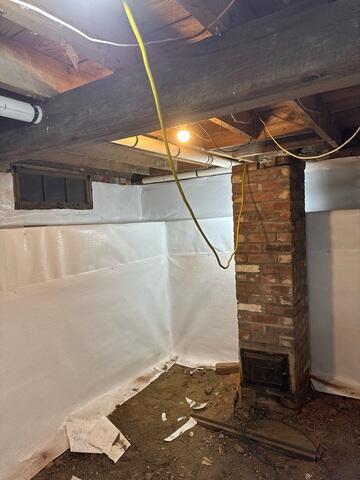 This crawl space in the basement of a home in Sheffield, Vermont, has begun its transformation from a cold, drafty, and sometimes wet area to a dry, warmer, and cleaner space.