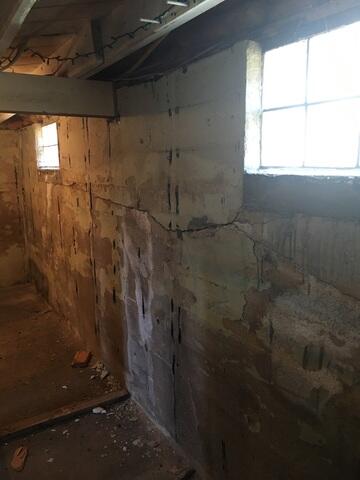 The foundation showing tremendous signs of cracking