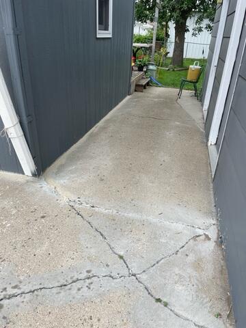 During: Our Foreman, Charlie, and his crew leveled the sidewalk back to its original position.