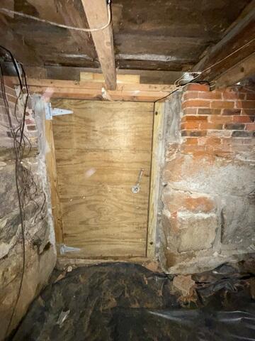 This damp crawl space in Florence, Vermont, will be sealed from any future moisture issues.