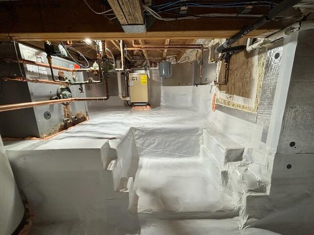The crawl space is now fully waterproofed and encapsulated, making a much safer environment for the utilities in the space as well as the home above.