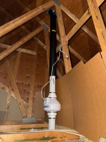 The attic of the garage where the fan is installed