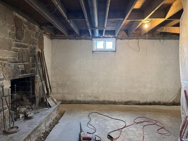 Damp block walls were showing signs of moisture buildup throughout the basement.