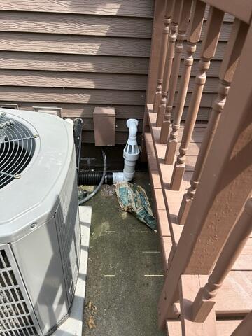 The IceGuard installed at the exterior of the home connecting to the sump pump