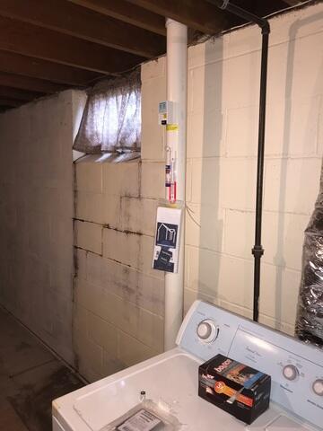 The foundation showing signs of stair step cracking