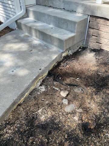 During: Our Foreman, Charlie, and his crew successfully lifted and leveled the sidewalk back to its original position.