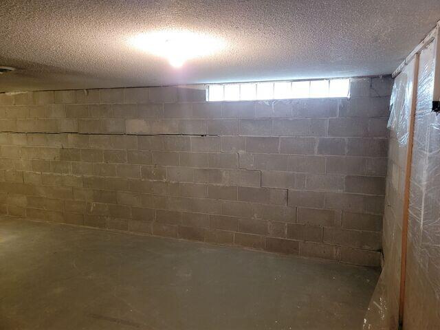 The home showing signs of a bad foundation such as stair step cracking, horizontal cracks, and a bowing wall