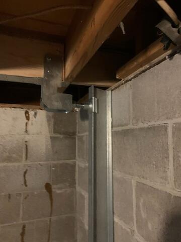 The PowerBrace installed along the floor joist