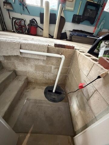 Before: Our Design Specialist, Ryan, recommended securing a brand-new sump pump and waterproofing system.