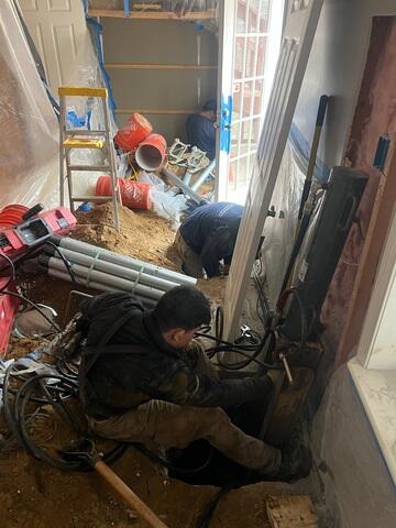 Installation process of the push piers in order to repair the foundation of the home in Woodbridge, VA