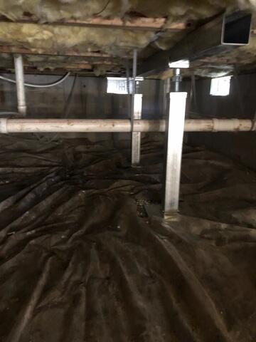 Supplemental beam and Smart Jacks installed to support the home and repair the sagging and sloping floors.