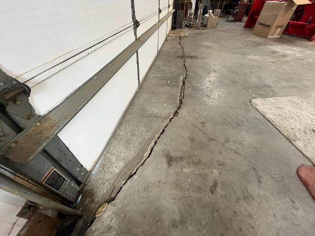 Before: Our Design Specialist, Ian, recommended securing several lifting points and stabilizing the garage floor.