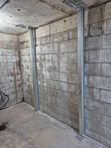 After our crew installed PowerBrace agains the walls to stop further movement