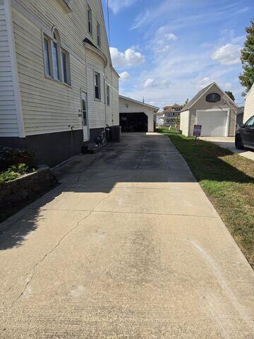 Before: Our Design Specialist, Nathan, recommended lifting and leveling the sidewalk back to its original level.