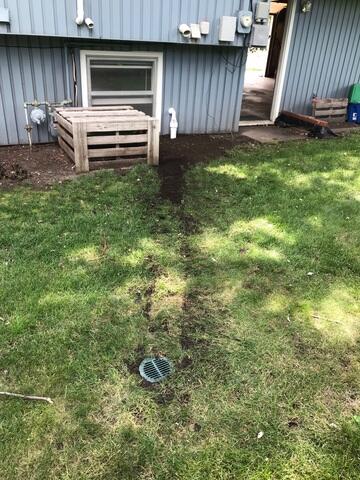 The IceGuard installed at the exterior of the home connecting to the sump system