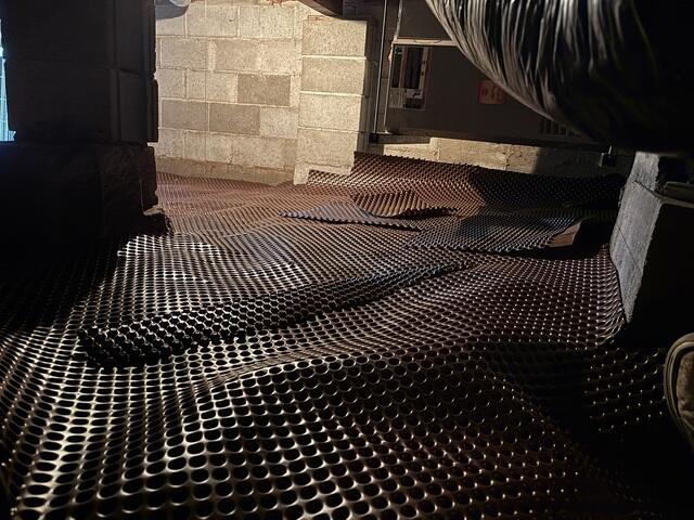 Mid-Install: Drainage matting laid down.