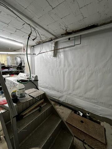 During: Our Foreman, Kingsley, and his crew worked hard to secure the products throughout the basement.