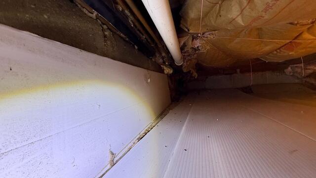 Before encapsulation, this crawl space was exposed to ground moisture and elevated humidity levels. The area lacked a proper vapor barrier and insulation system, leaving the space vulnerable to damp conditions and energy loss.