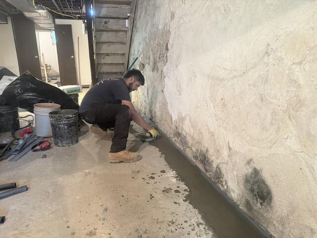 As installation progressed, the crew completed the final stages by concreting over the WaterGuard system. Once finished, the drainage system remains concealed beneath the basement floor while continuing to capture and direct water away from the space.