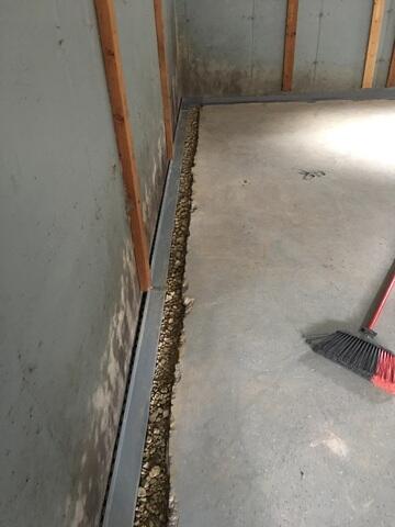 The edges are drilled, rocks are added and WaterGuard is placed on top