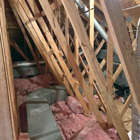 This ductwork is leaking conditioned air into the attic and is exposed to extreme summer heat, causing the cooled air inside the ducts to warm up before it ever reaches the rooms below.