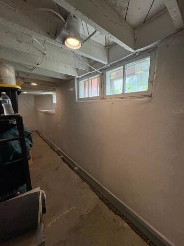 Our crew attached CleanSpace to the walls and installed WaterGuard along the perimeter of the floor