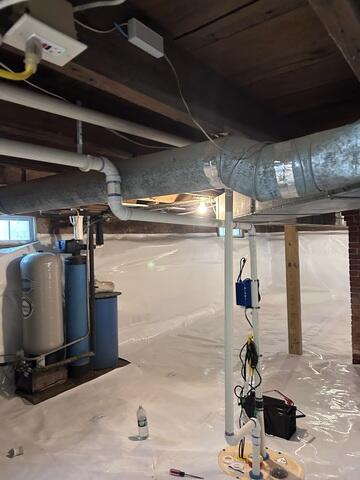 CleanSpace: A durable crawl space liner installed across the floor and walls to create a cleaner, brighter barrier between the home and the exposed ground.
Drainage Matting: Installed beneath the liner in key areas to help direct water below the encapsulation system.
Sump Pump System: Installed to collect and pump water out of the crawl space.