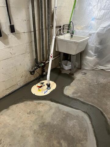 Sump pump system tied to the leech line and perimeter drainage system to pump out any water that may enter.