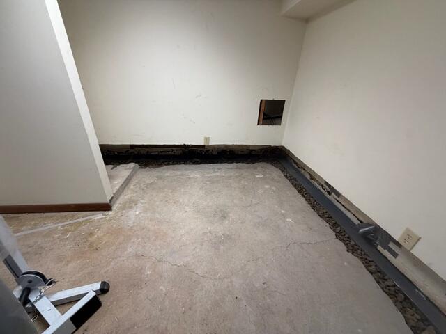 Our crew removed the ruined carpeting and about a foot of the drywall near the baseboards to install the WaterGaurd French drain system.