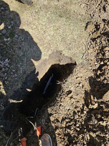 The earth anchor is placed into the soil and connected to the interior wall plate through a small steel pole