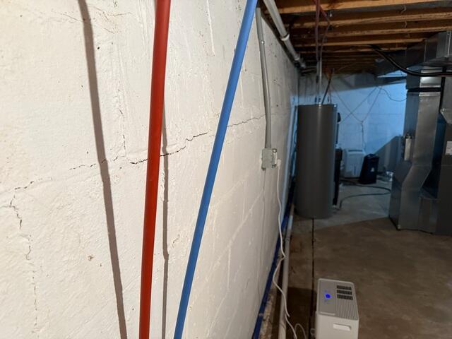 The foundation wall where it can be seen bowing and tilting inward