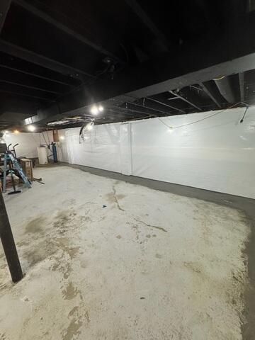 The CleanSpace Wall System was installed along the basement walls to help create a cleaner, brighter wall surface while working with the waterproofing system. When water enters through the foundation wall, CleanSpace helps direct it down into the drainage system rather than allowing it to continue staining the walls or spreading into the basement. The interior drainage system was installed around the perimeter of the basement to collect water at the base of the foundation wall. Once water enters the drainage system, it is directed to the sump pump system so it can be removed from the basement before it reaches the main floor.