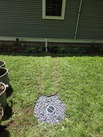 IceGuard was installed on the exterior discharge line to help protect the system if the discharge line freezes or becomes blocked. It provides an alternate route for water to escape, which is especially helpful during cold New England weather.
The LawnScape outlet was installed at the end of the discharge line to allow water to exit the home cleanly and at a low profile. This helps complete the system by carrying water away from the foundation.
Results