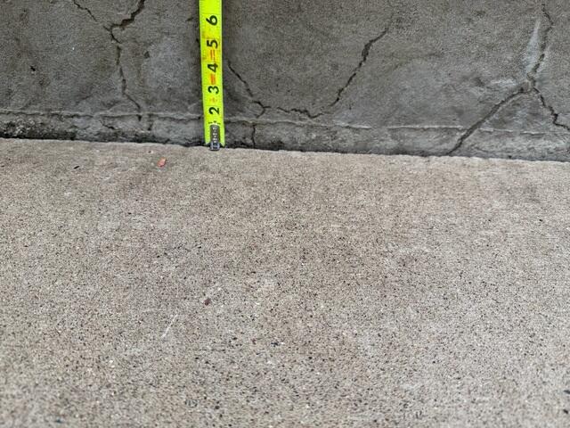 A close-up to show how much the slabs along the walkway had sunken.