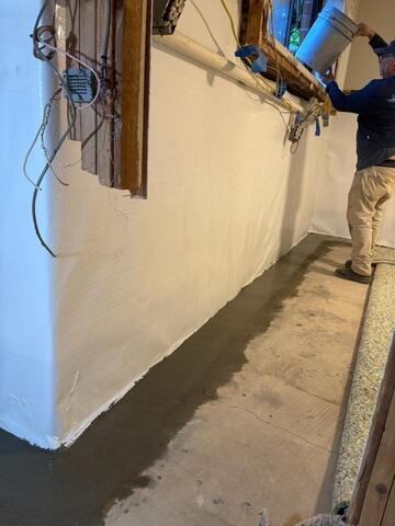 Finished installation of the full perimeter waterproofing system.