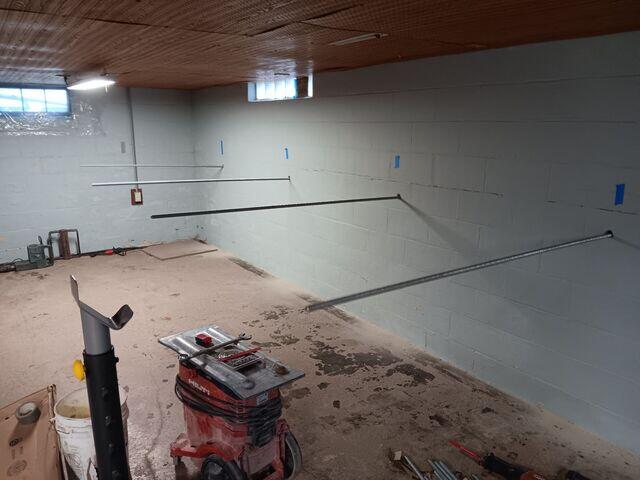 During: Our Foreman, Chris, and his crew worked hard to secure all the foundation repair products throughout the basement.