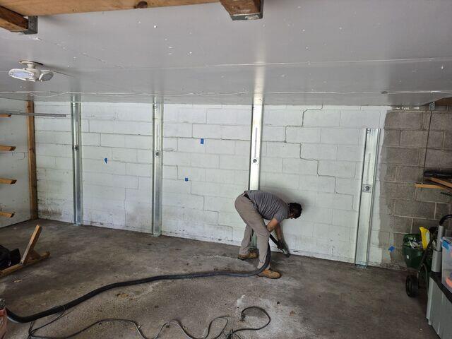 The channel anchors were secured to the wall and floor to stop movement.