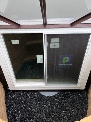 The open view of the exterior exit of the egress window.