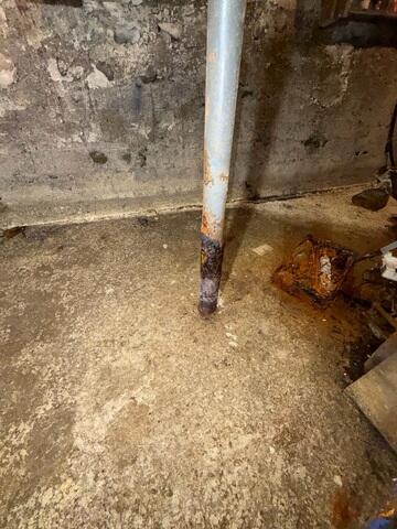 This old, rusting, and structurally unsafe support column will be replaced with a SmartJack system.