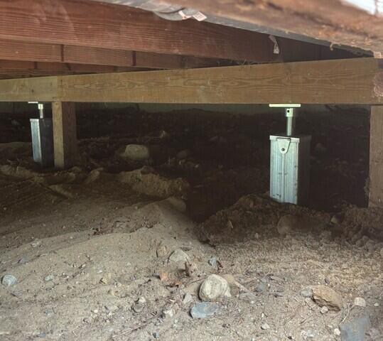 Now the home is properly supported with our SmartJack Stabilizing System.