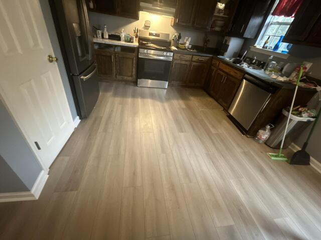 Installation of Luxury Vinyl Plank Flooring (LVP), restoring the home to pre-loss condition.
