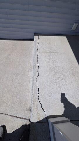 Before: Our Design Specialist, Derek, recommended lifting the sunken slabs and repairing the cracks.
