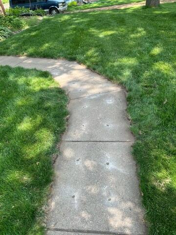 After our crew lifted and leveled the area eliminating the slope