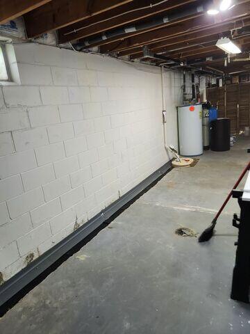 WaterGuard is placed along the perimeter of the floor and SuperSump+ is installed